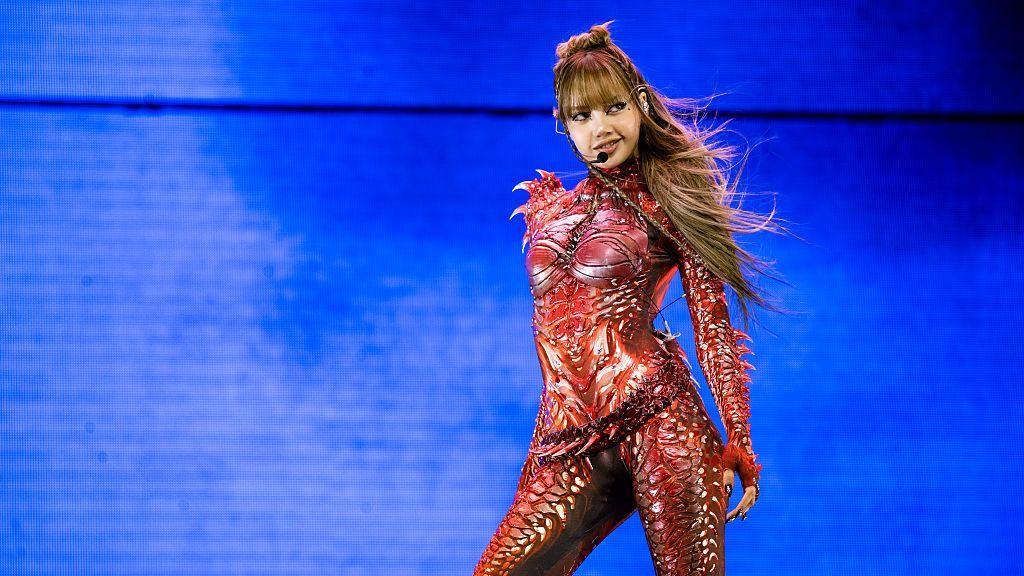Lisa performs in a futuristic red bodysuit during the 2025 Coachella Music Festival