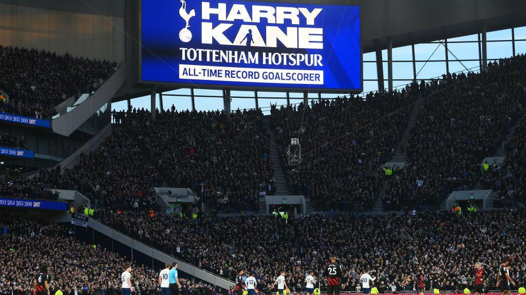 A big screen shows Harry Kane breaking Tottenham's goalscoring record