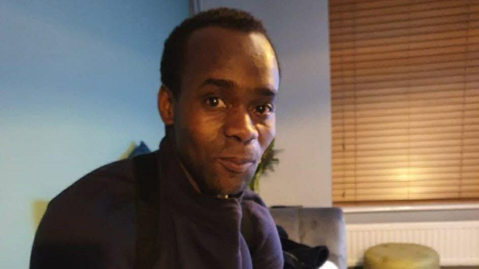 Anton Green smiles and looks at the camera.