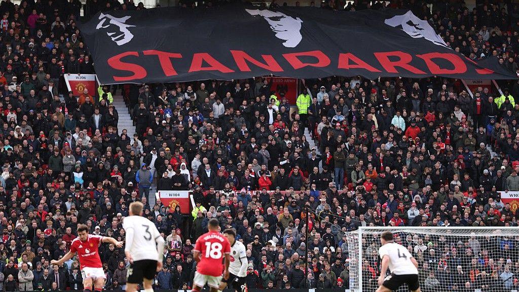 Manchester United fans unfurled a 'Standards' banner during the 3-0 defeat to Bournemouth, showing the images of three legendary captains Bryan Robson, Eric Cantona and Roy Keane