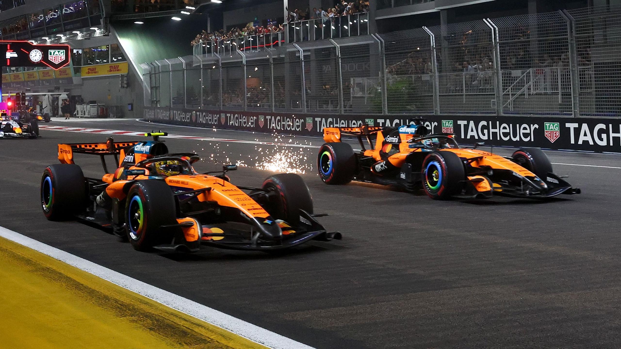 Lando Norris and Oscar Piastri move away at the start of the Singapore Grand Prix