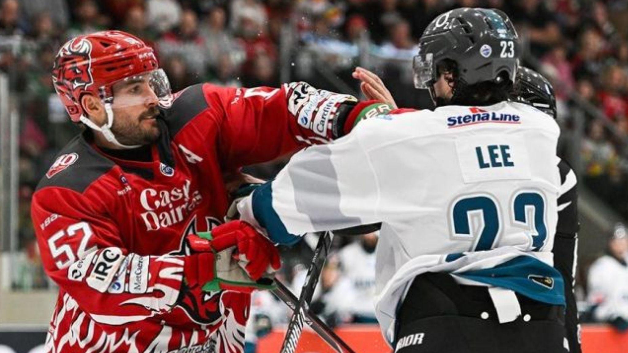 Cardiff Devils' Jimmy Oligny in red and Mike Lee of Belfast in white fight