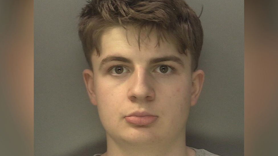 A mugshot of Benjamin Day looking at the camera. He has brown eyes and brown hair.
