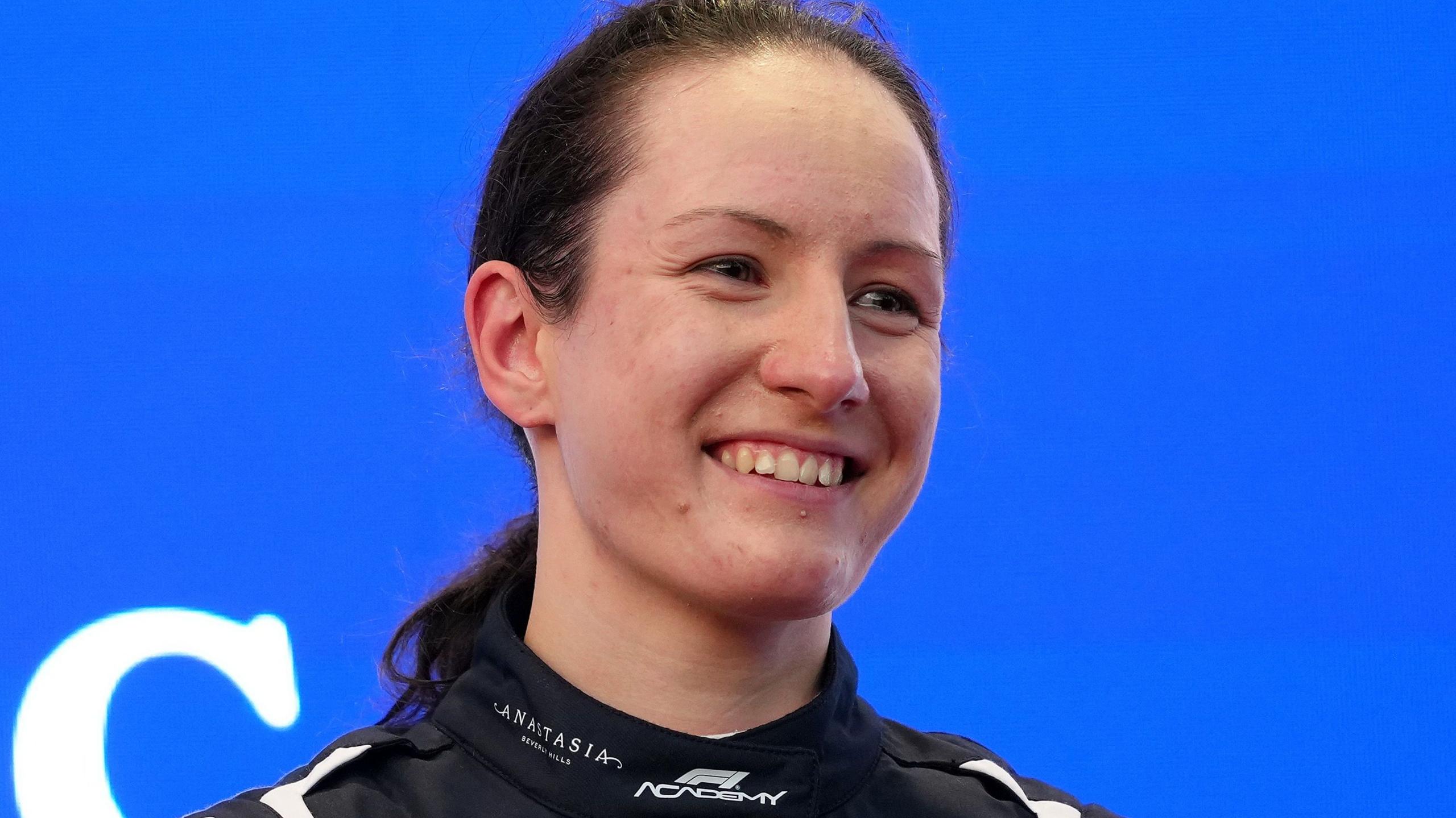 Alisha Palmowski smiles after winning the 2026 F1 Academy title