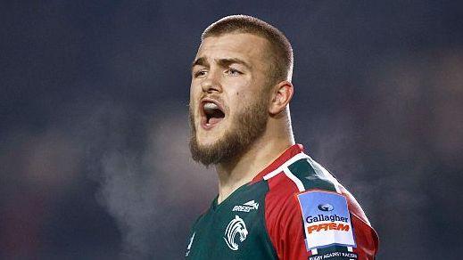 Finn Theobald-Thomas in a green and red Leicester Tigers jersey during a match.