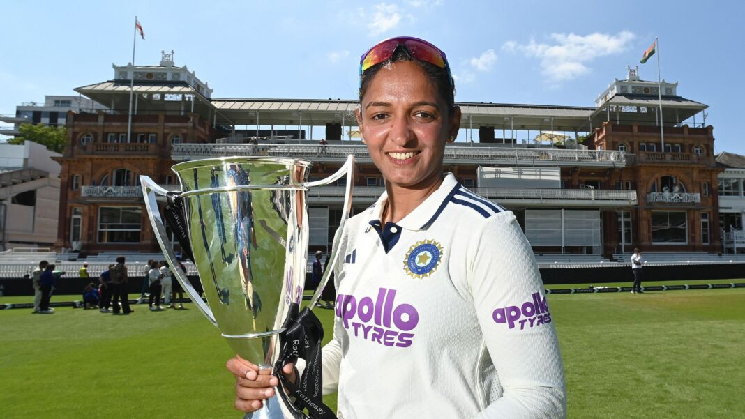 Mandhana replaces Harmanpreet as India captain Harmanpreet Kaur, wearing cricket whites and holding a trophy, standing in front of the Lord's pavilion