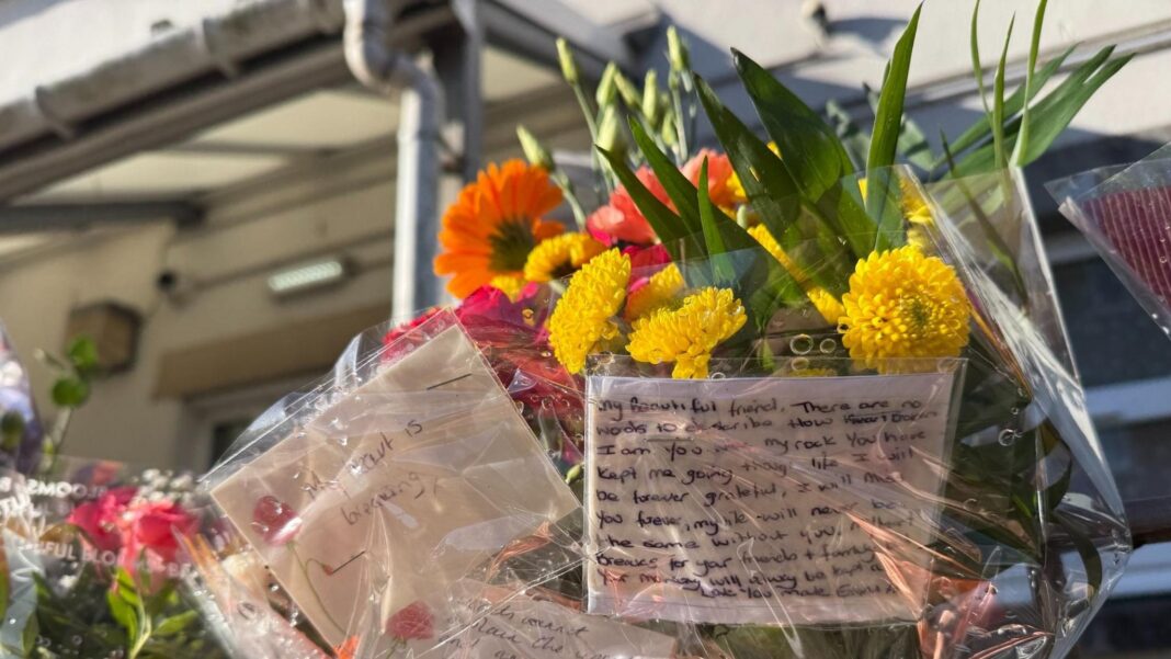 Man, 61, charged with murder after ‘stabbed’ woman dies following crash Floral tribute left at scene