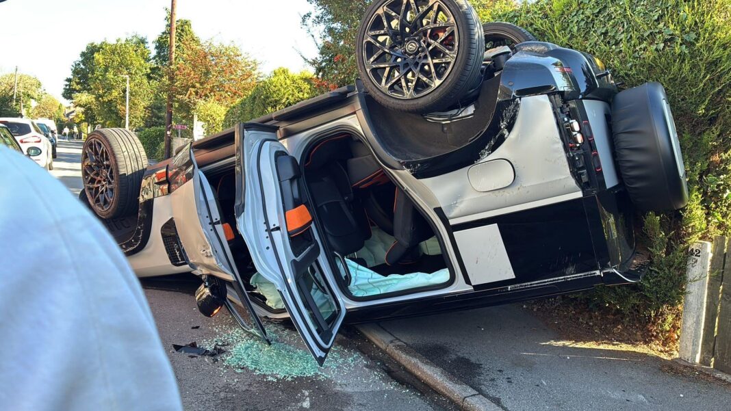 Second Hull City player crashes near training ground A silver car is overturned on its roof with all the doors open, glass shattered on the road. It is half on the pavement next to a bush, half on the road.