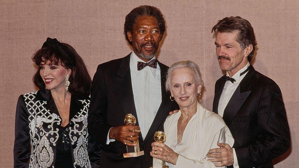(L-R) English actress actress Joan Collins, American actor Morgan Freeman, English and American actress Jessica Tandy and American actor Tom Skerritt in the press room during the 47th Golden Globe Awards at the Beverly Hilton Hotel in Beverly Hills, California, 20th January 1990.