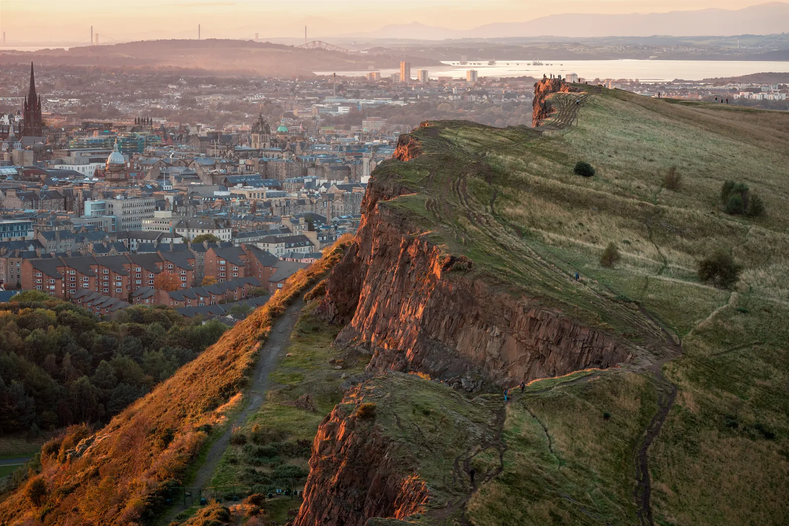Image may contain Cliff Nature Outdoors Scenery Mountain Person Architecture Building Cityscape and Urban