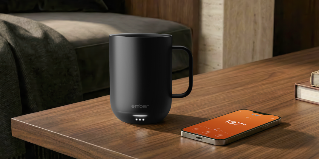Ember’s new temperature-controlled mug makes my nightly tea ritual even better Ember table with phone dark black 10oz 030326