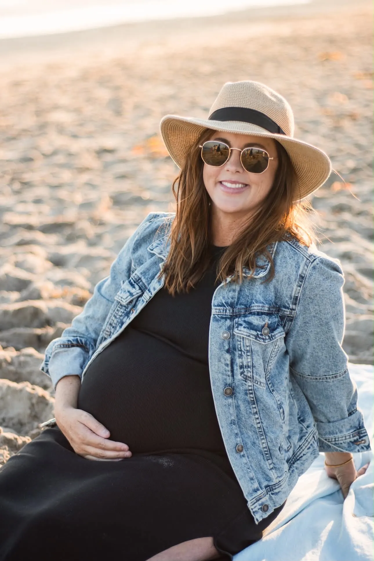 Image may contain Clothing Pants Beachwear Adult Person Face Happy Head Smile Photography Portrait and Jeans