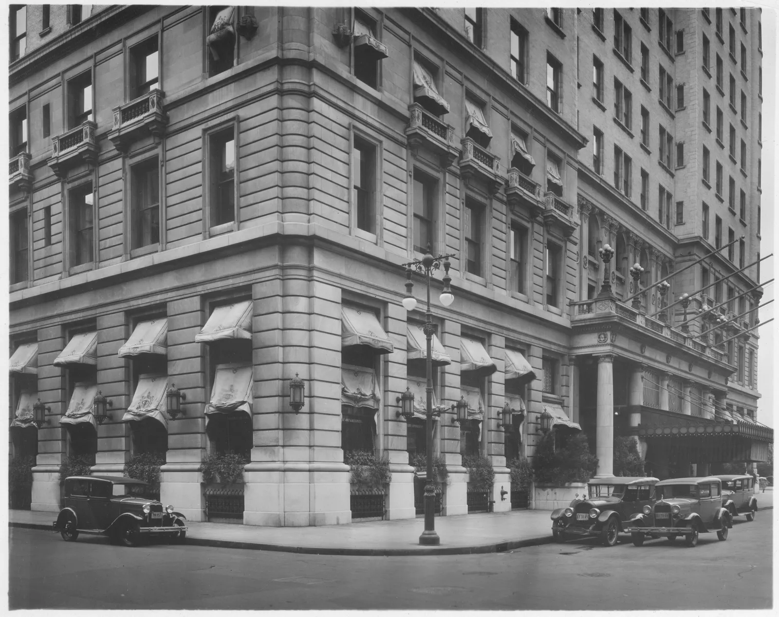 Image may contain City Urban Road Street Architecture Building Apartment Building High Rise Awning Canopy and Car