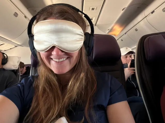 Image may contain: Cushion, Home Decor, Face, Head, Person, Photography, Portrait, Happy, Smile, Accessories, and Sunglasses