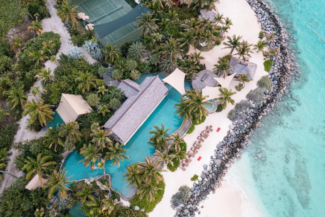 The Best All-Inclusives in the Caribbean for Effortless Escapes Necker island necker island main beach crocodile pavilion aerial 2