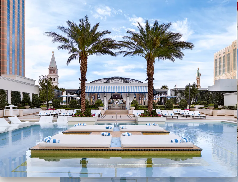 Image may contain: Summer, Architecture, Building, Hotel, Resort, Pool, Water, Plant, Tree, Swimming Pool, and Chair