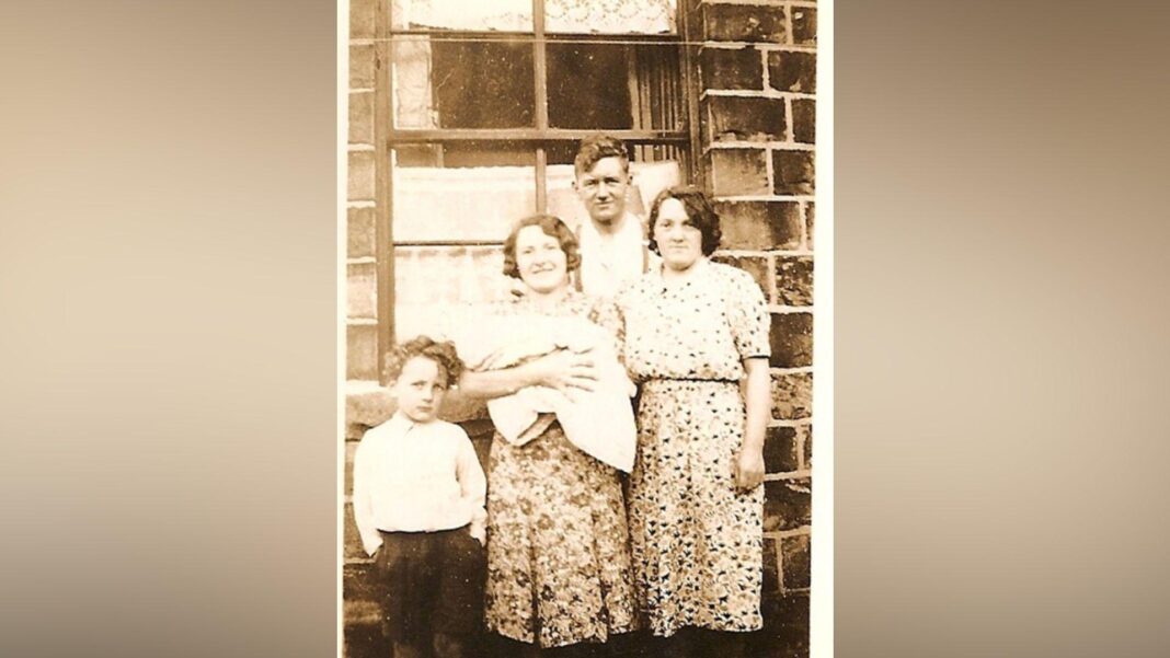 Baby Patrick seen being held by his Aunt Dolly. He is seen with his mother (right) and brothers Trevor (left) and Geoff