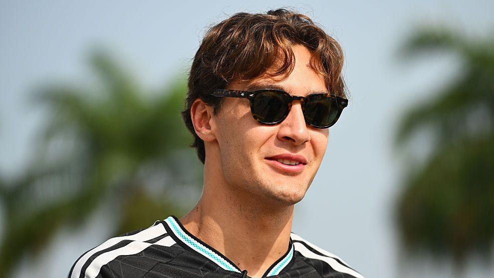 George Russell wears sunglasses in the Malaysia paddock