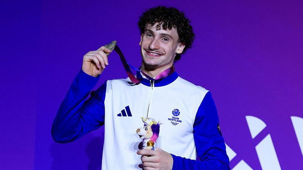Reuben Ward receiving his pommel horse silver medal at the 2026 Commonwealth Games