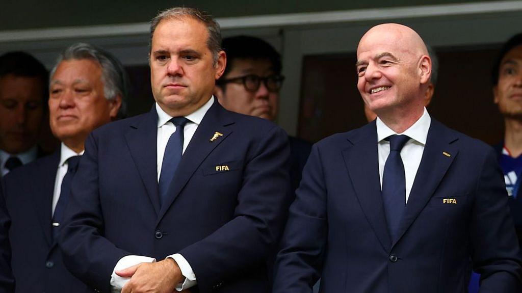 Concacaf president Victor Montagliani looks on next to FIFA president Gianni Infantino