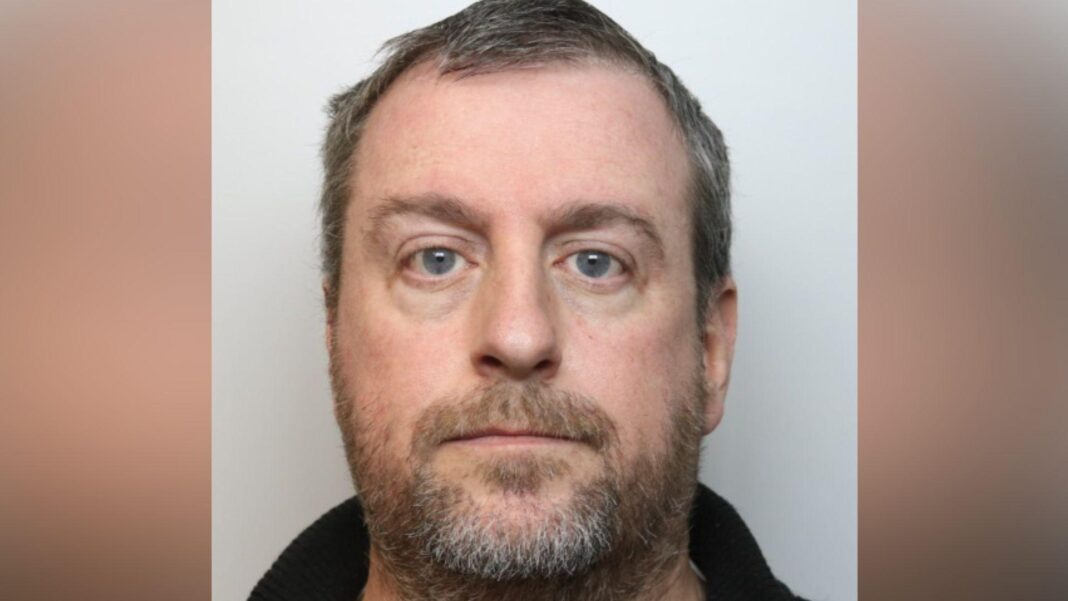 Blindfolded wife ‘felt stranger’s hand’ during sex with husband, court told Police head and shoulders image of Young, who has short greying hair and a brown/grey beard.