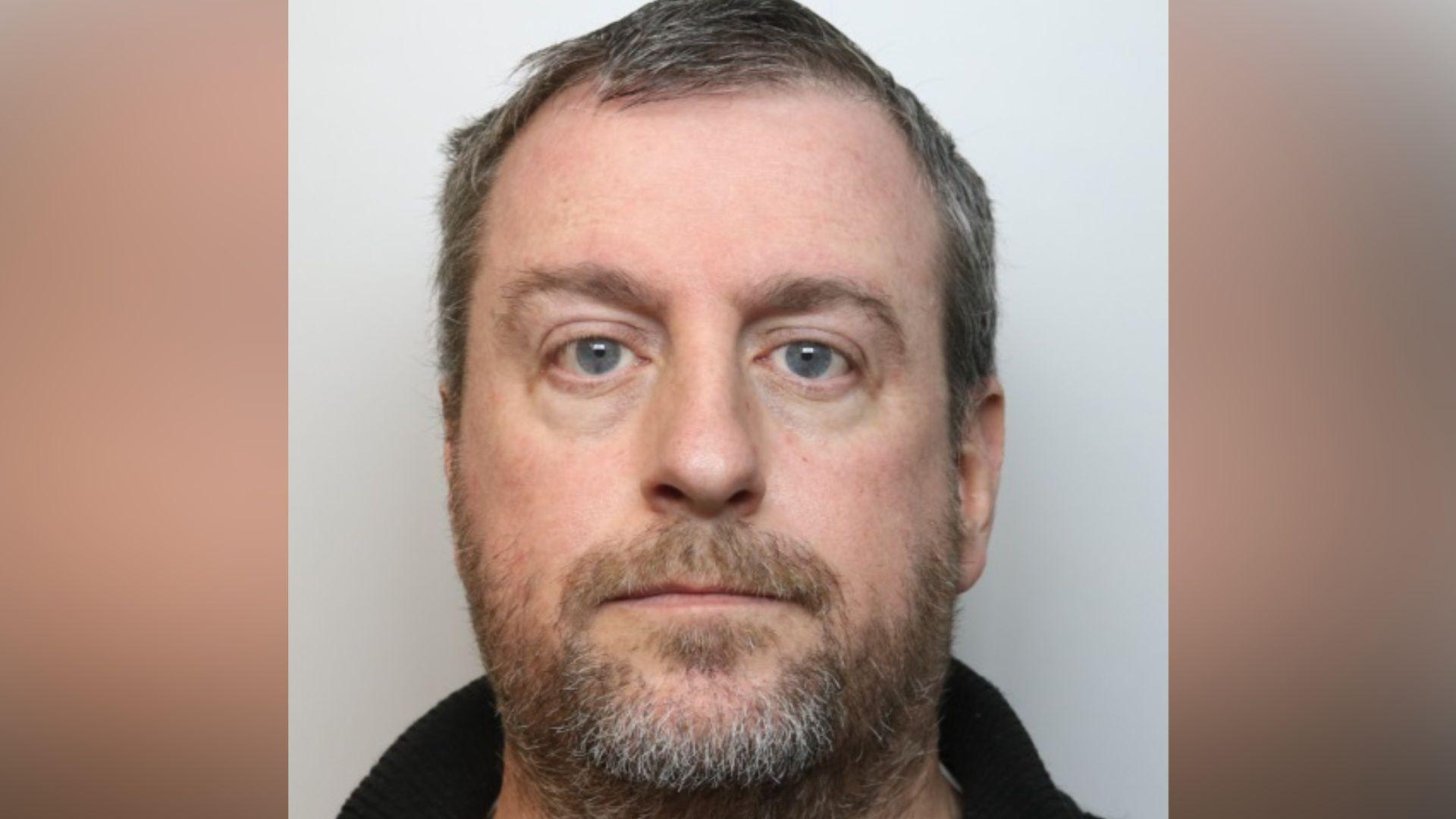 Police head and shoulders image of Young, who has short greying hair and a brown/grey beard.