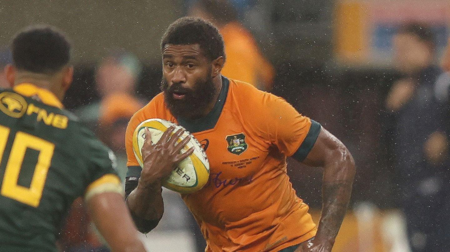 Marika Koroibete carries the ball under his right arm for Australia against South Africa