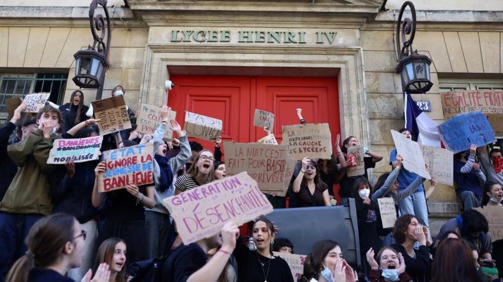 French high school students gather outside the Lycee Henri IV high school in Paris