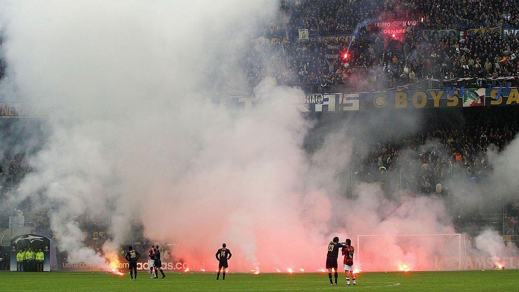 Rui Costa and Marco Materazzi are pictured in the foreground of this wide image, just as Rellandini was lining up his famous photo