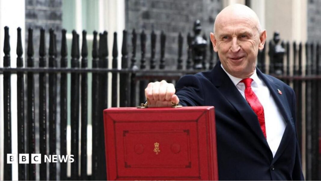 Chancellor holds red box outside No 11 Chancellor holds red box outside No 11