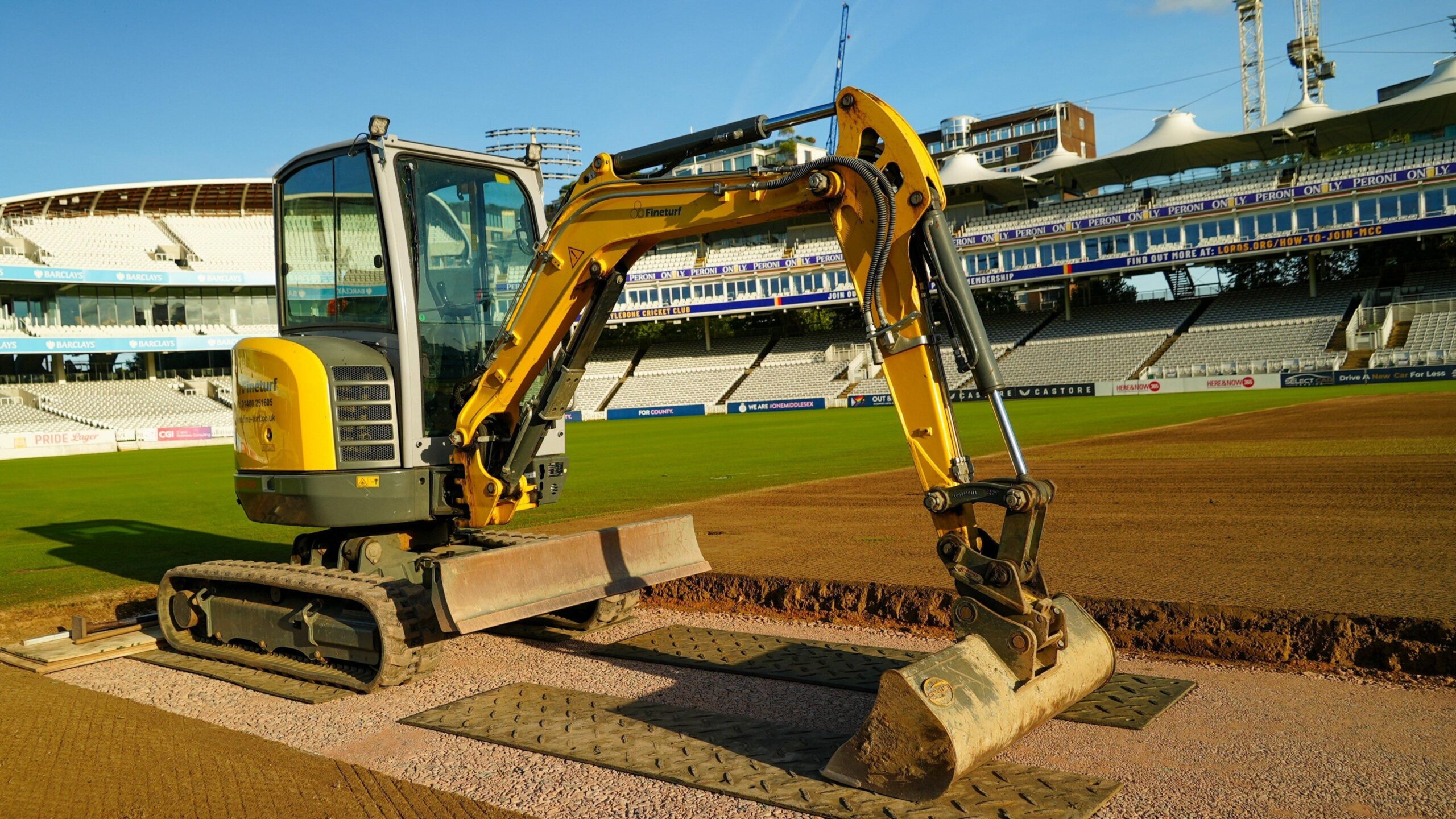 Digger on the square at Lord's during work on pitch