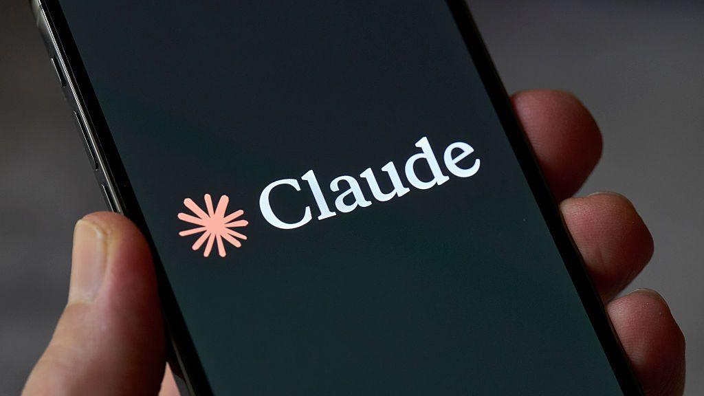 Claude logo on a phone screen. It looks like an orange splash.