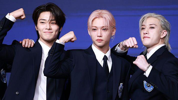 Stray Kids members I.N, Felix and Bang Chan celebrate the launch of their fourth full-length album, Karma, at a press conference in Seoul, August 2025