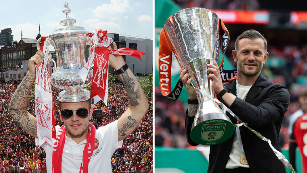 Jack Wilshere holding the FA Cup and the Vertu trophy