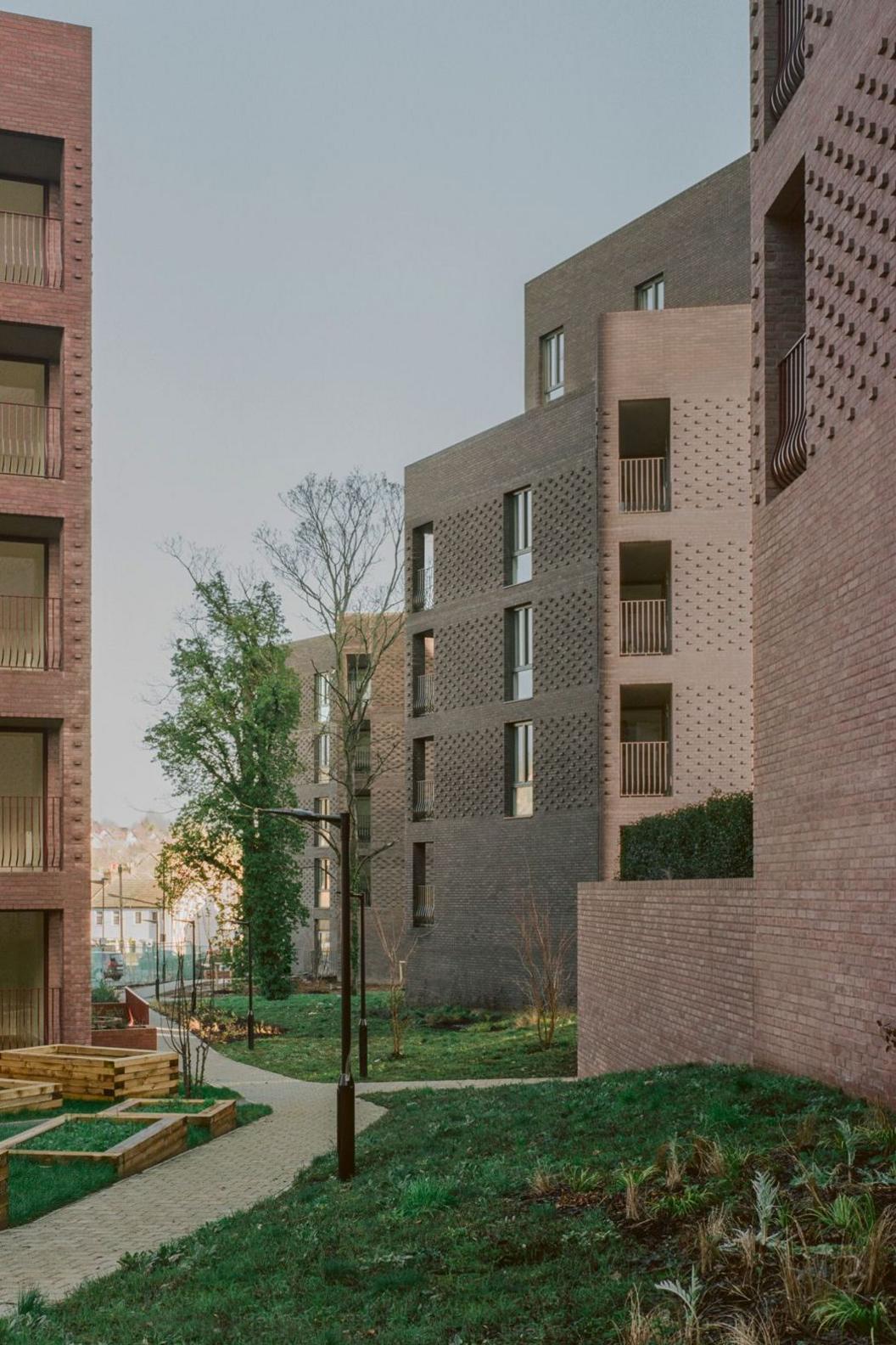Low rise flats built with purple and pink brinks