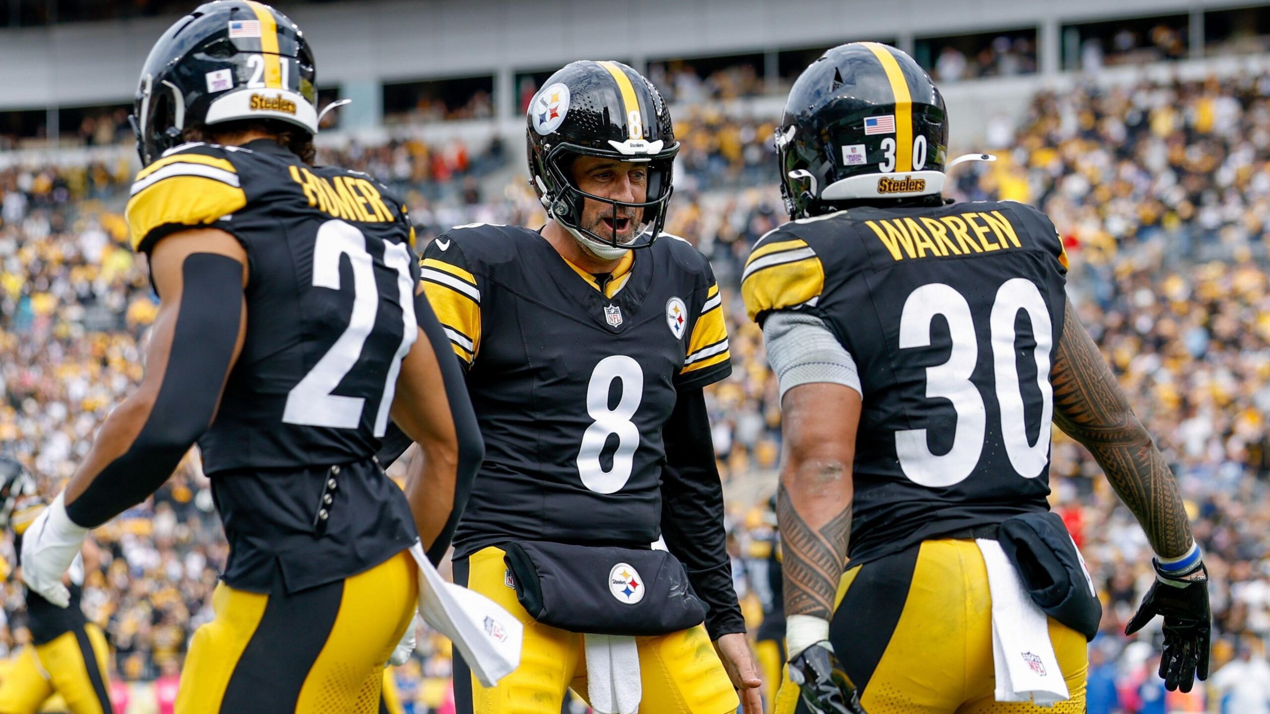 Aaron Rodgers celebrates throwing a touchdown for the Pittsburgh Steelers