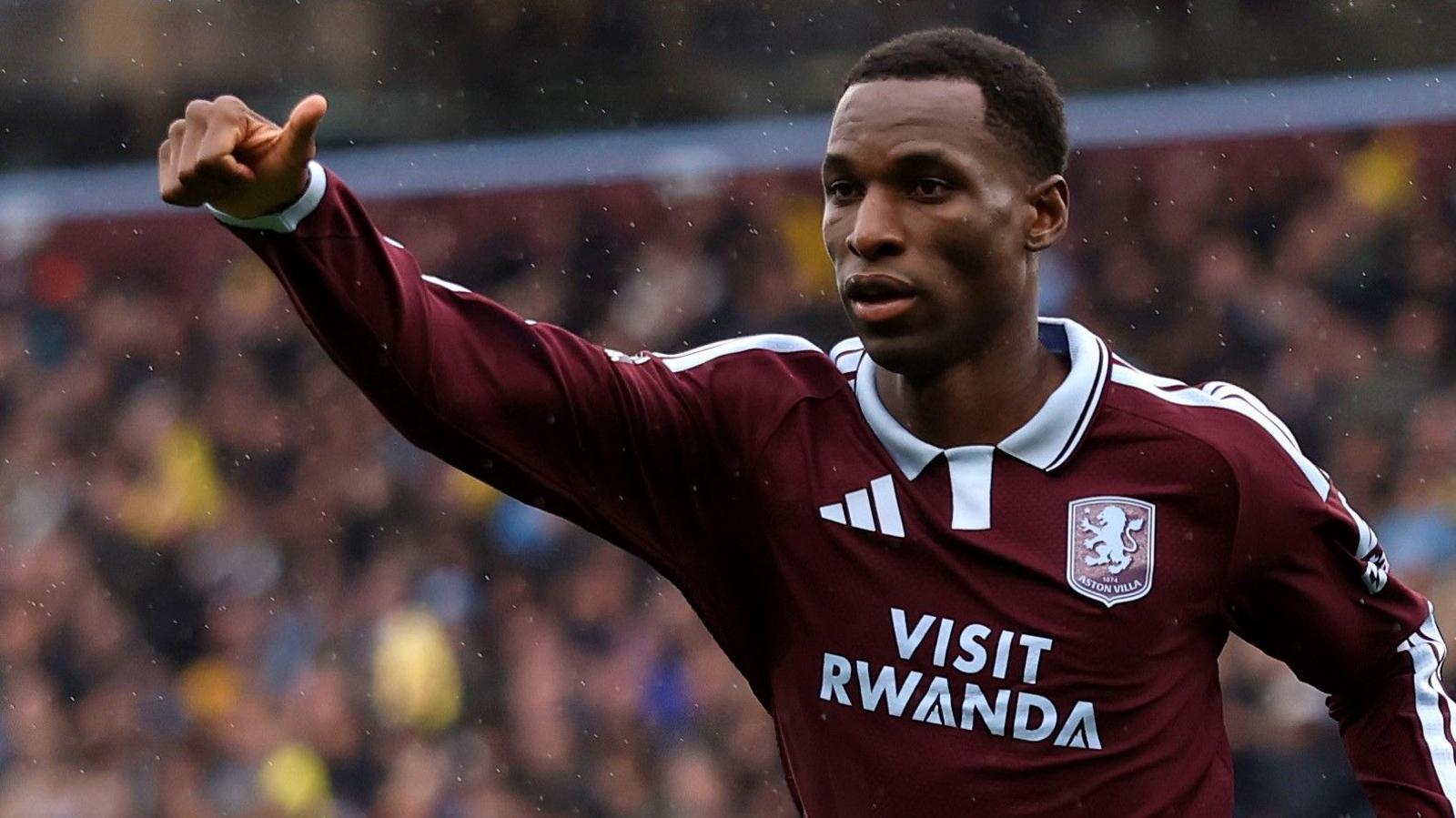 Nicolas Jackson, wearing a claret and blue shirt, celebrates a goal for Aston Villa against Manchester City