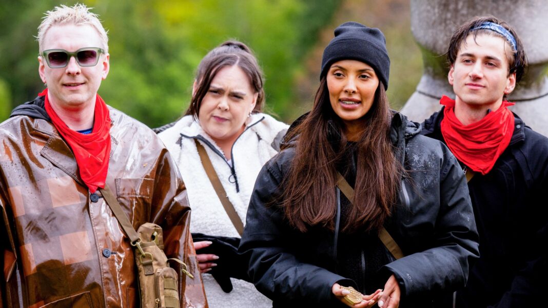 Joe Lycett, Sharon Rooney, Maya Jama and Bash standing in a row outdoors with red neckerchiefs during a mission