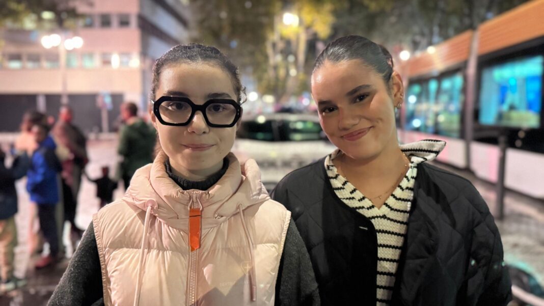 Marseille braces for more unrest after protests give way to ‘apocalyptic’ disorder Two young women pictured in Marseilles, smiling at the camera in front of a tram stop at night. Maryam is on the right. She has dark brown hair which is pulled back, and wears a black jacket above a v-neck striped black and white top. Jade is on the left. She also has dark hair pulled back, and wears thick black-framed glasses. She is wearing a light pink gilet above a black jumper.