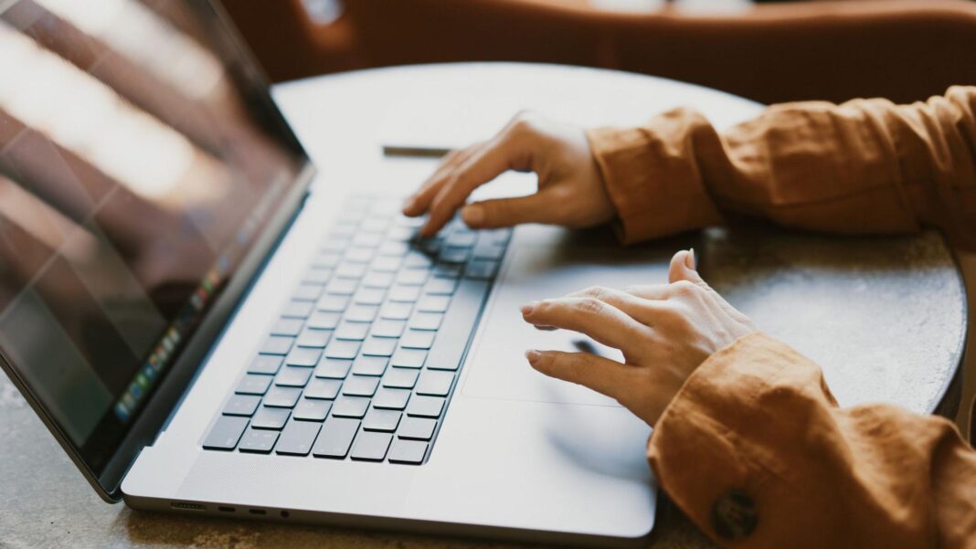 Websites taken down worldwide as critical cyber-security update issued Hands on a computer keyboard