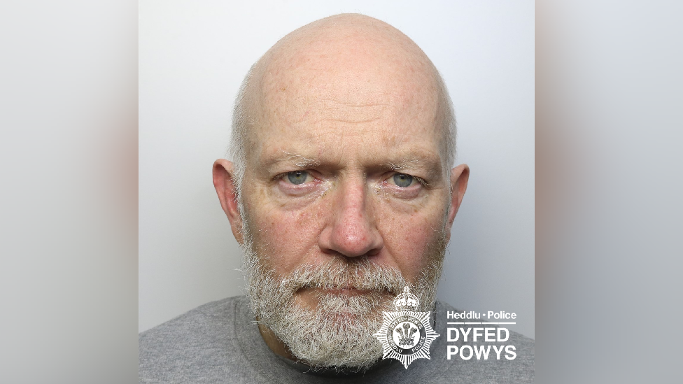 James McKenna. A picture of a bald man with a white beard. He looks at the camera. It is a headshot - a police mugshot and there is the Dyfed-Powys Police watermark at the bottom right-hand corner.