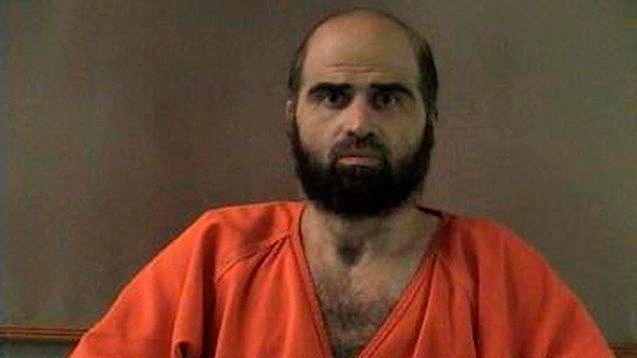 Nidal Hasan, charged with killing 13 people and wounding 31 in a November 2009 shooting spree at Fort Hood, is pictured in an undated handout photo obtained by Reuters on June 29, 2012.