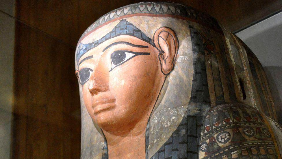 Lady Shep-En-Hor's sarcophagus  on display at The Hunterian Museum in Glasgow. The sarcophagus is multicoloured and has a number of Egyptian hieroglyphics on it.