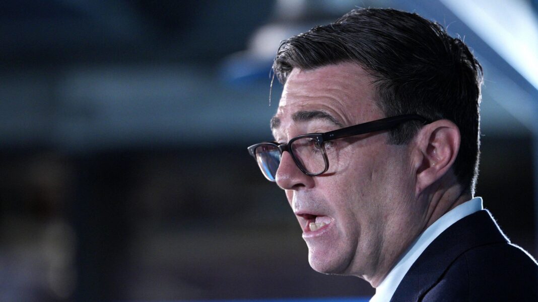 PM says it is ‘clear’ Russia interfered with Brexit vote Close-up shot of Andy Burnham's face. The prime minister is wearing a dark suit jacket and light blue shirt.