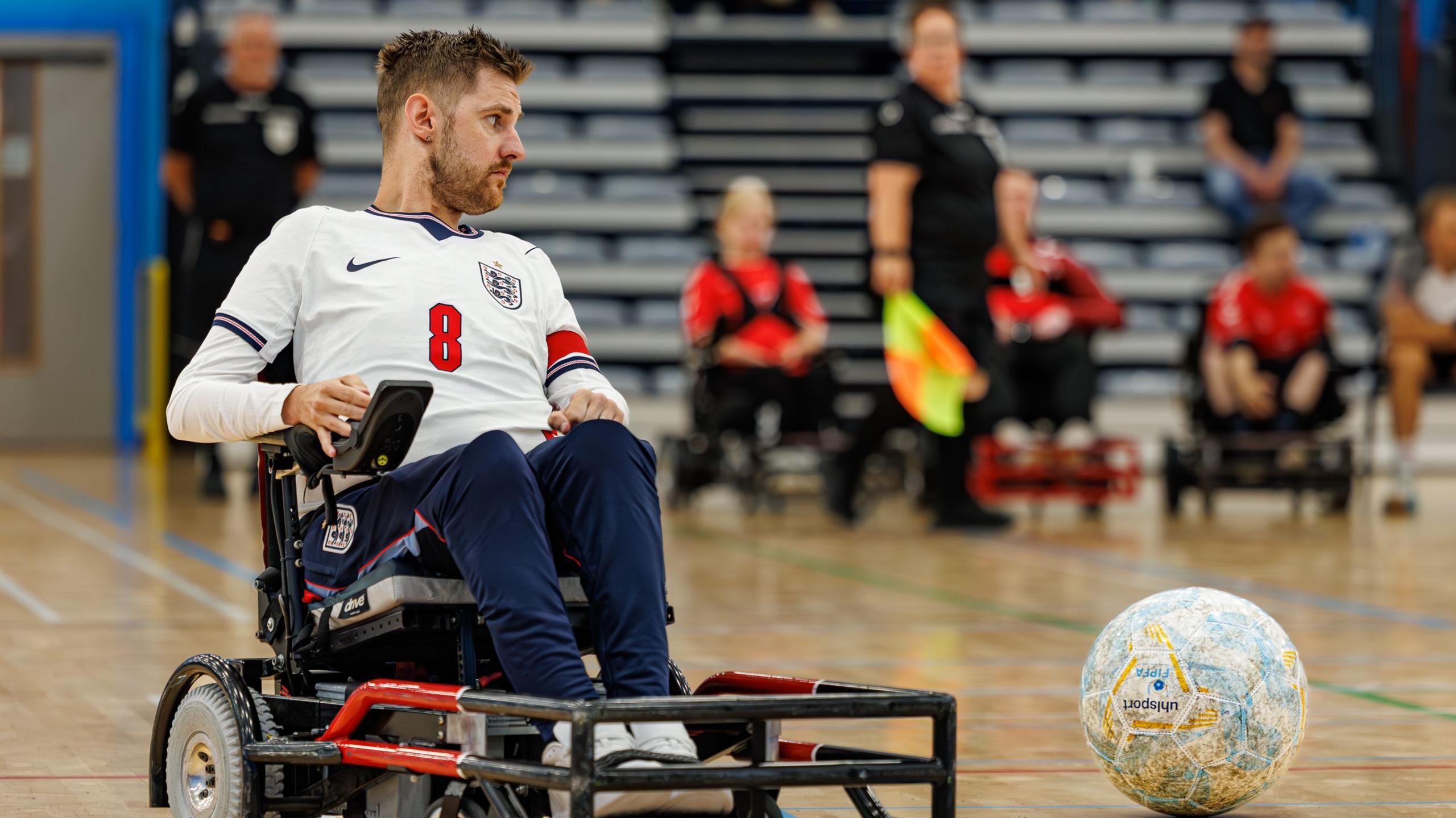 Jon Bolding can be seen using a powerchair at an England match in July 2026