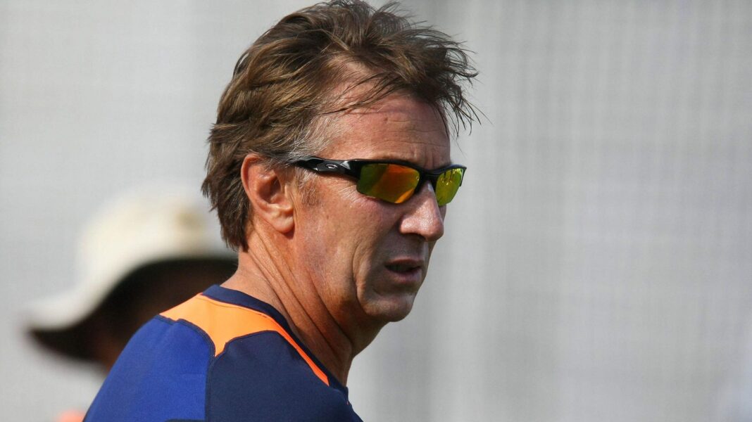 A headshot of Eric Simons wearing sunglasses