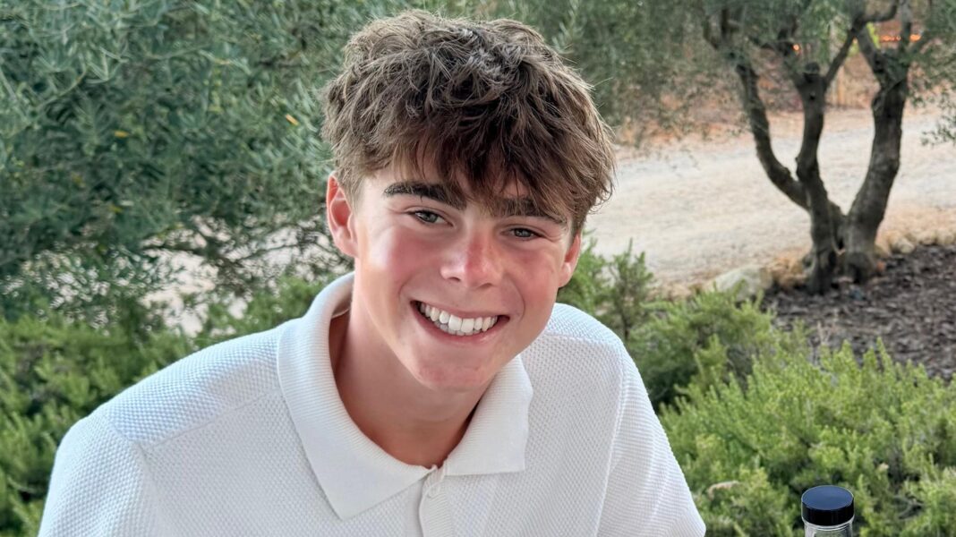 We’re saving £100 a month for our kids but they won’t get it until they’re 57 Hugo Thompson smiles at the camera. He is wearing a white polo shirt and sat in front of olive trees in a field