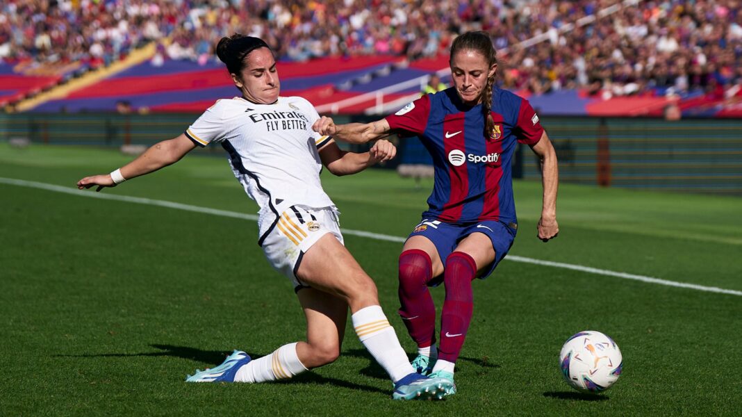 Oihane Hernandez of Real Madrid competes for the ball with Ona Batlle of FC Barcelona during a November 2023 Liga F match