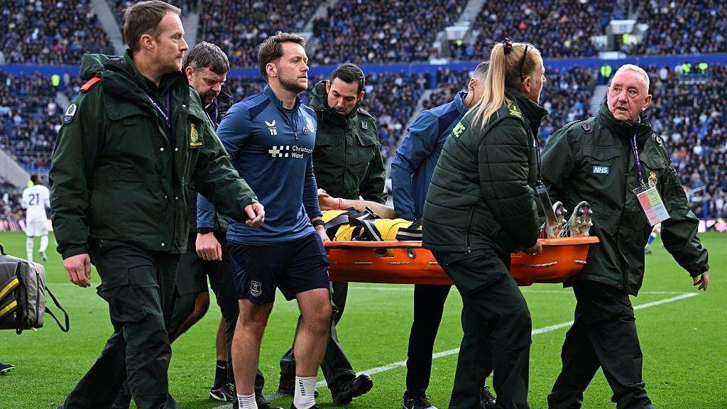 Emiliano Martinez carried off on stretcher