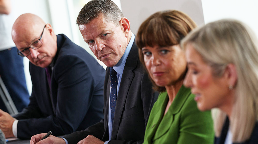 Michelle O'Neill, Mary Lou McDonald, Rhun ap Iorwerth and John Swinney at a press conference, sitting at a table